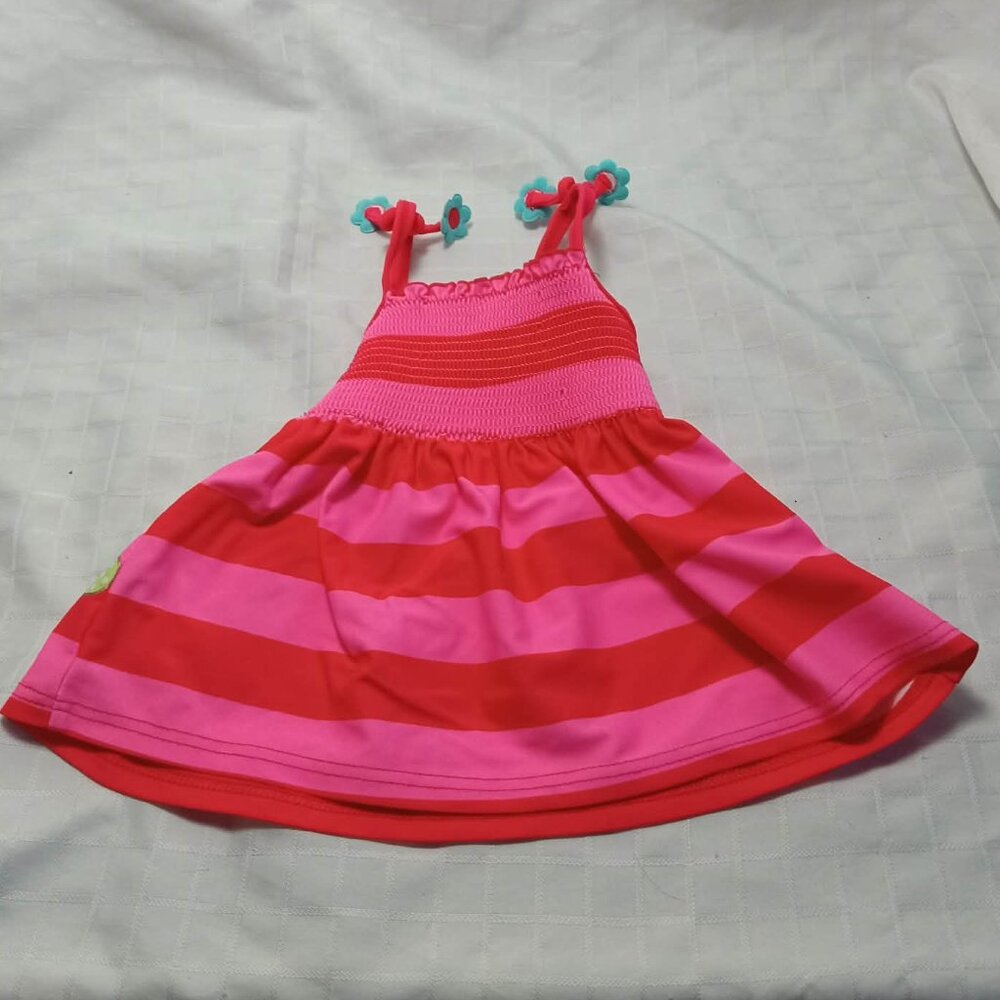 Striped swim top for baby with floral pattern and unique straps, 2005